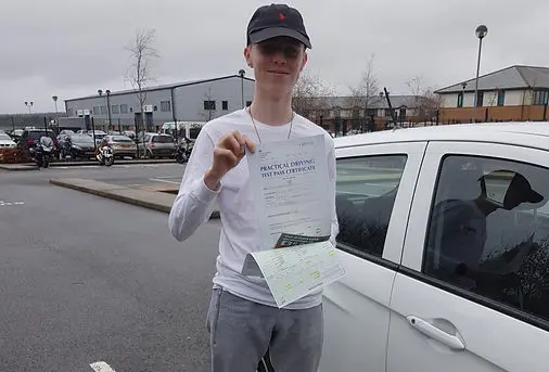Successful driving test pass certificate held by student 12 who learned with Jo Learn To Drive driving school